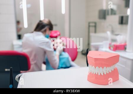 Dentistry, medical equipment of dental instruments, Dental instruments, dental equipment, in the dental clinic. Female dentist and kid blur in the Stock Photo