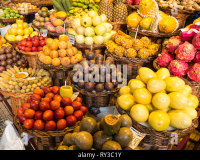 Large selection of colorful fresh fruits at a market in Funchal on the island of Madeira, Portugal Stock Photo