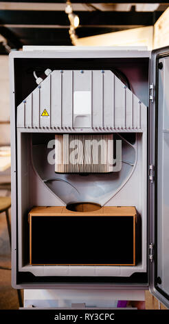 Open door of a central unit of a modern technology Central Vacuum Systems in modern home  Stock Photo