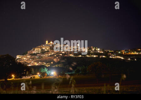 Panoramic night view of the medieval town of Trevi in Umbria (Italy). Landscape format. Travel concept. Stock Photo