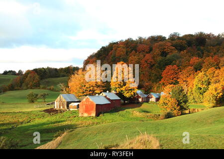 Fall image of Jenny Farm in rural Vermont with sunlight casting dramatic light on the landscape. Stock Photo