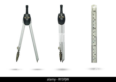 Compasses drawing and Metal ruler on a white background. Stock Photo