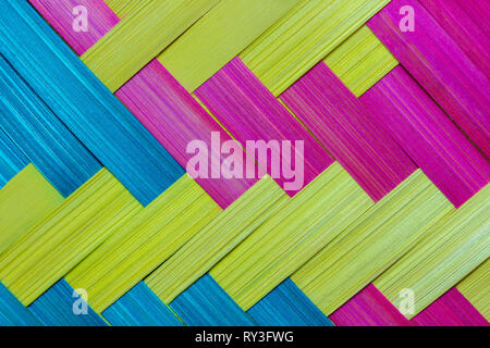 Closeup the bamboo was cut into thin sheets, dyed colorful and was woven into a piece. Stock Photo