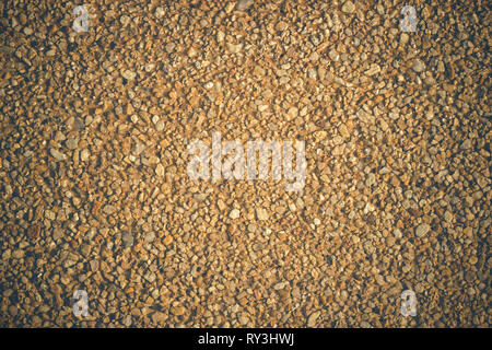 Texture of the wall was built with small pebbles. Suitable for construction or architecture articles background. Stock Photo