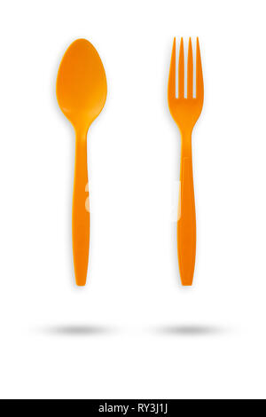 Orange plastic fork and spoon on isolate white background with clipping path. Stock Photo