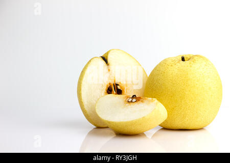 Chinese pear and reflection on white background. Healthy fruit. Stock Photo