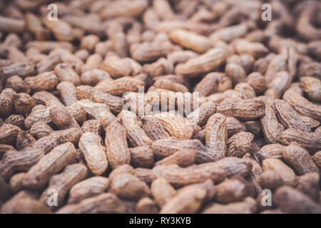Texture of many peanuts are dried in the sun. Concepts of agricultural. Stock Photo
