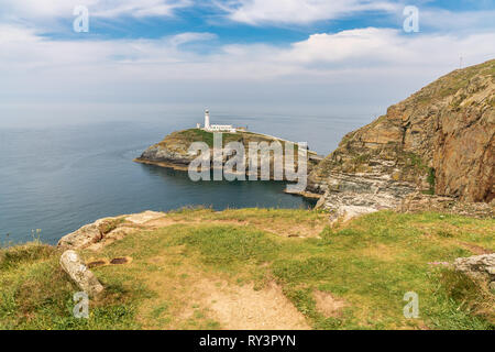 Near Holyhead, Anglesey, Gwynedd, Wales, UK - June 08, 2018 - View towards the cliffs and South Stack Lighthouse Stock Photo