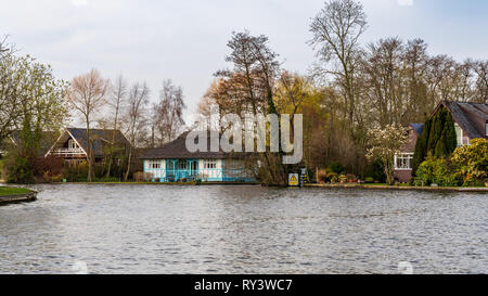 Wroxham, Norfolk, England, UK - April 07, 2018: Houses on the shore of the River Bure in The Broads Stock Photo