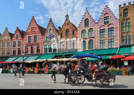 Belgium, Western Flanders, Bruges, historical centre listed as World Heritage by UNESCO, Horse-drawn carriage tour on Markt square Stock Photo
