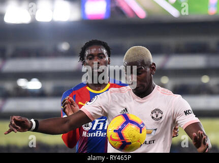 LONDON, ENGLAND - FEBRUARY 27, 2019: Jeffrey Schlupp of Palace and Paul Pogba of Manchester pictured during the 2018/19 Premier League game between Crystal Palace FC and Manchester United at Selhurst Park. Stock Photo