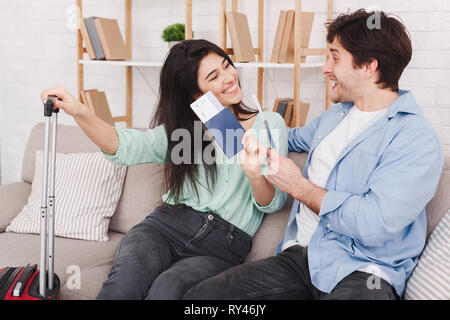 Happy couple with passports and tickets at home Stock Photo