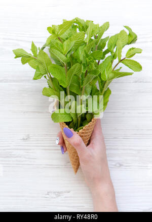 A woman holds an ice cream as over 4000 worshippers gather for morning ...