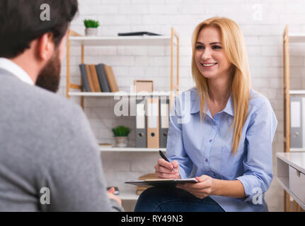 Psychologist having session with patient in office Stock Photo