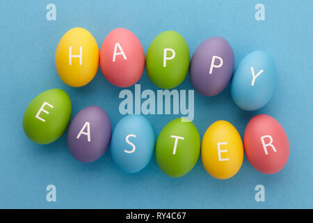Painted eggs arranged in Happy Easter greeting Stock Photo
