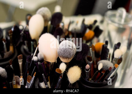 Brushes make-up artist of different colors and textures.Job. Stock Photo