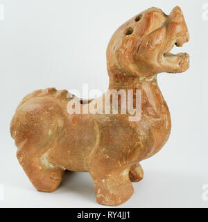 Lion in Chinese terracotta. Used as a guardian of the house, showing the family flag. Dating from the 60s. Isolated on a white background. Stock Photo