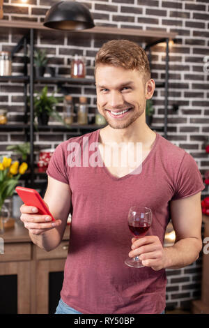 Bearded husband feeling excited before romantic dinner with his woman Stock Photo