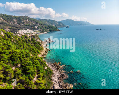 Beautiful tropical coastline with a rocky beach on the island of Corfu located in Greece. Stock Photo