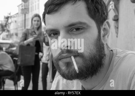 Me having a smoke at a coffee shop in Milan Stock Photo