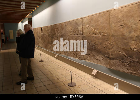 In ancient Assyria, lion-hunting was considered the sport of kings, symbolic of the ruling monarch’s duty to protect and fight for his people. The sculpted reliefs in Room 10a of the British museum  illustrate the sporting exploits of the last great Assyrian king, Ashurbanipal (668-631 BC) and were created for his palace at Nineveh (in modern-day northern Iraq). Stock Photo