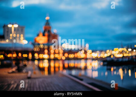 Helsinki, Finland. Abstract Blurred Bokeh Architectural Urban Background Of Uspenski Cathedral And City Embankment. Real Defocused Backdrop Lights Of Stock Photo