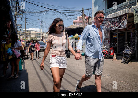 Older man, younger woman. Thailand Southeast Asia Stock Photo
