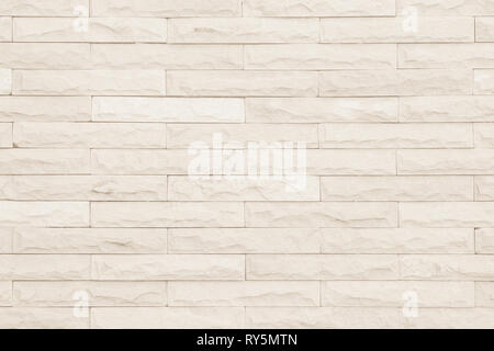 Cream and white brick wall texture background. Brickwork or stonework flooring interior rock old pattern clean concrete grid uneven bricks design stac Stock Photo