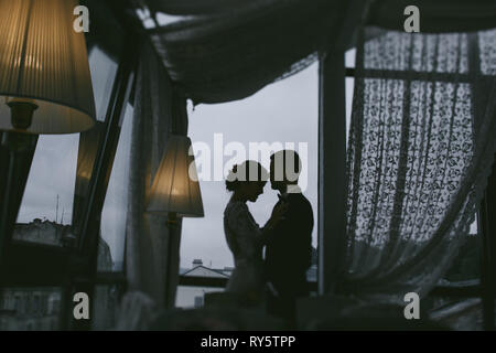 groom and bride in a hotel Stock Photo