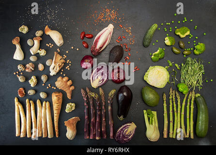Flat lay of various fresh vegetables on black table Stock Photo