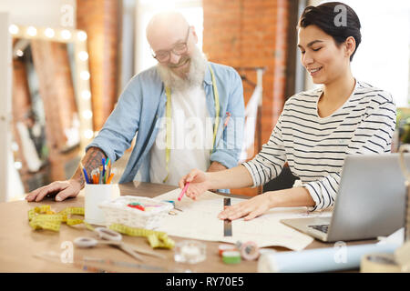 Colleagues working in studio Stock Photo