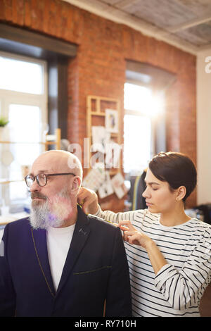 Fitting in tailoring shop Stock Photo