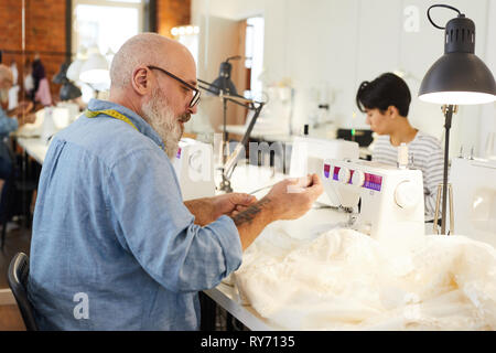 Using sewing machine Stock Photo