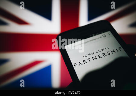 John Lewis Partnership (JLP), an employee owned UK company. Logo on its website is seen on a smartphone display Stock Photo