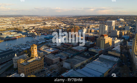 The POV moves in towards downtown with the Murray Morgan Bridge and Mt. Rainier in the background Stock Photo
