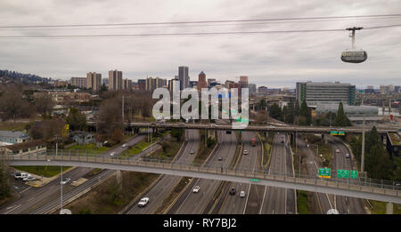 The cable car is full of riders exploring Portland via aerial transportation Stock Photo