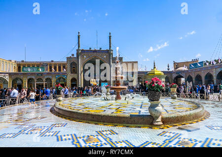 Qom Fatima Masumeh Shrine Madrasa View with Fountain and Crowd Stock Photo