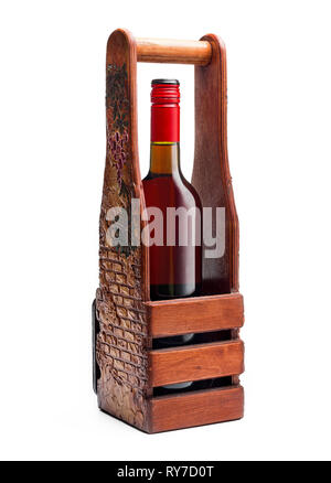 bottle of red wine in a handmade wooden box is isolated on a white background. Vintage. Stock Photo