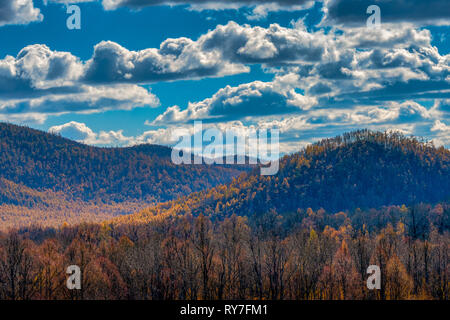 Forested Mountains Against Dramatic Clouds During Autumn in Inner Mongolia, China Stock Photo