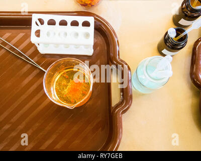 Molecular gastronomy dessert, orange pearls, molecular cuisine Stock Photo