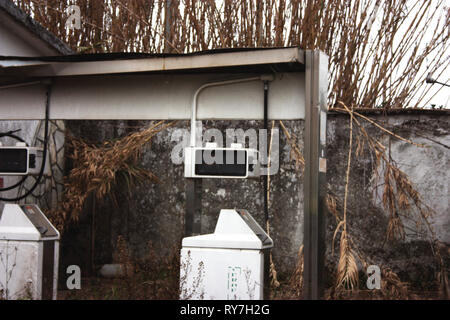 unused dispenser of an old abandoned petrol station over time Stock Photo