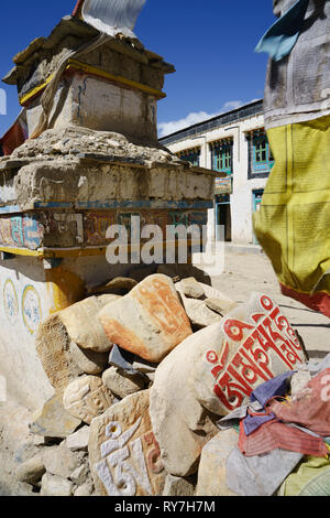 Buddist chorten with mani prayer stones and prayer flags, Lo Manthang, Upper Mustang region, Nepal. Stock Photo