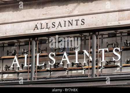 All Saints shop front in a commercial building in London listed department store block designed by Sir Henry Tanner (1921) for Dickins & Jones Stock Photo