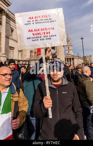 Algeria protest took place in Trafalgar Square London, UK demanding President Abdelaziz Bouteflika s immediate resignation and a democratic government Stock Photo