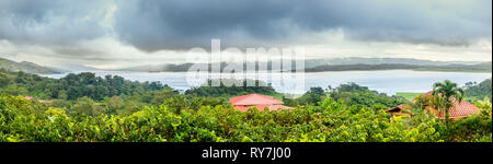 Panoramic view of Lake Arenal in central Costa Rica under dramatic cloudy sky Stock Photo