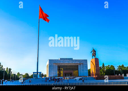 Bishkek Ala Too Square Waving Kyrgyz Flag on Flagpole with Hero Manas Statue and State History Museum View Point Stock Photo