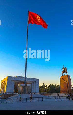 Bishkek Ala Too Square Waving Kyrgyz Flag on Flagpole with Hero Manas Statue and State History Museum View Point Stock Photo