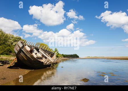Old wooden hull of a ship wreck in the bay. Traeth Dulas, Isle of Anglesey, North Wales, UK, Britain Stock Photo