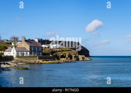 Bay Cafe on on rocky coast overlooking the sea. Benllech, Isle of Anglesey, North Wales, UK, Britain Stock Photo