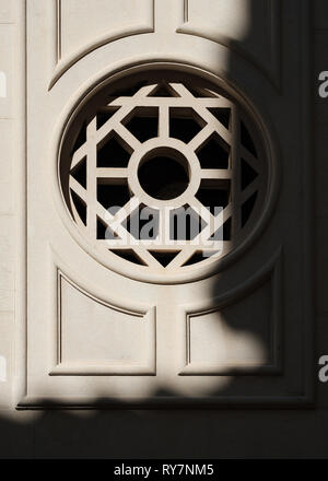 Semi-abstract view of an ornate window in the old town with a shadow on the wall, Dubrovnik, Croatia Stock Photo